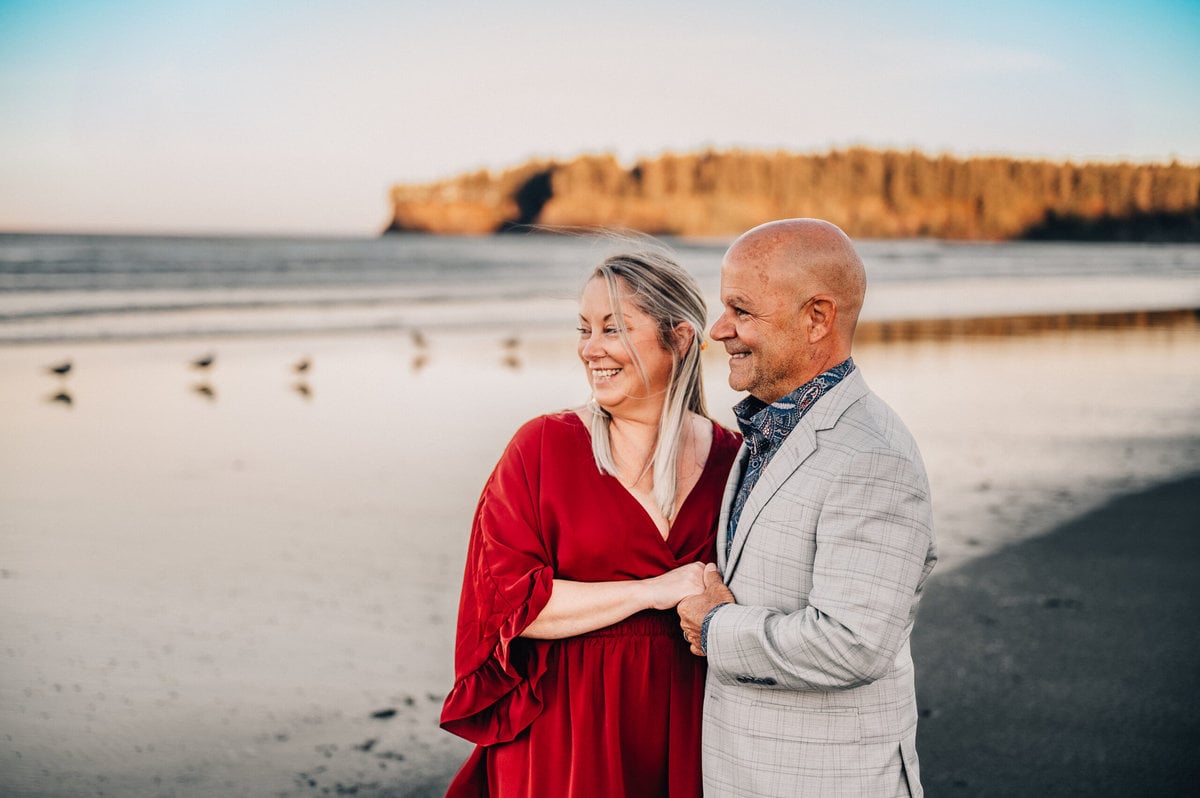 A couple celebrates their elopement on the beach of the Hobuck Beach Resort